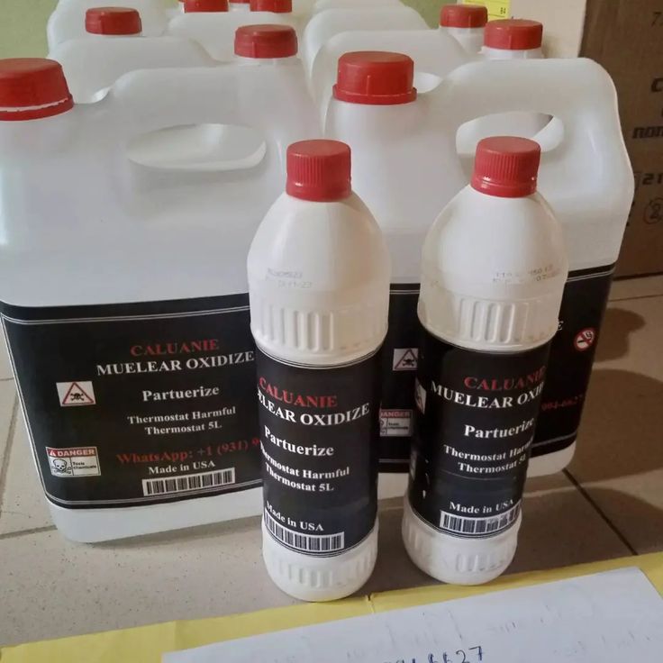 Laboratory experiment showing the oxidation process of Caluanie Muelear with safety equipment in use.